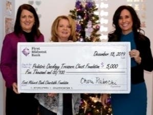 (Pictured left to right): First Midwest Bank Residential Lender Maureen Cipolla, Treasure Chest Foundation Founder and CEO Colleen Kisel  and Senior Vice President Cheri Rubocki  proudly display the First Midwest Charitable Foundation’s $5,000 donation.