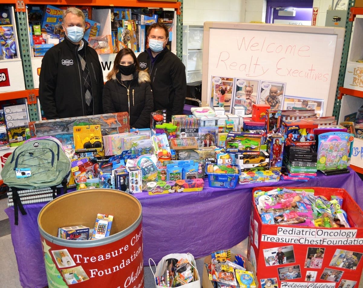 (Pictured l-r): Lemont Realty Executives Elite toy delivery team members Dan Gleason, Realty Executives Elite Owner Chris Budz and Megan Beechen are shown at the Treasure Chest Foundation’s Orland Park facility with over 560 toys collected.