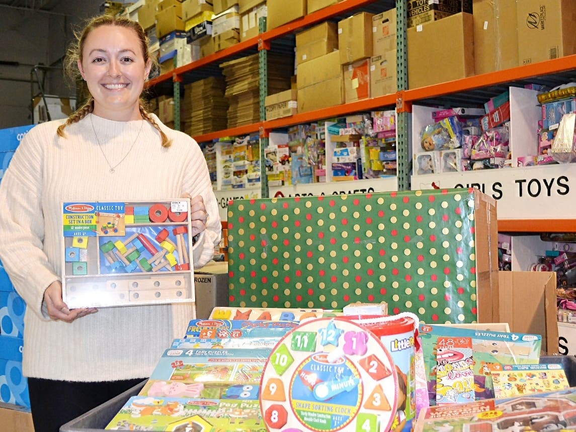 Bridget Williams, Science Teacher at Joliet West High School Health and Medicine Academy, among some of the educational toys at the Treasure Chest Foundation’s Orland Park warehouse. The toys will benefit brave young cancer patients nationwide.