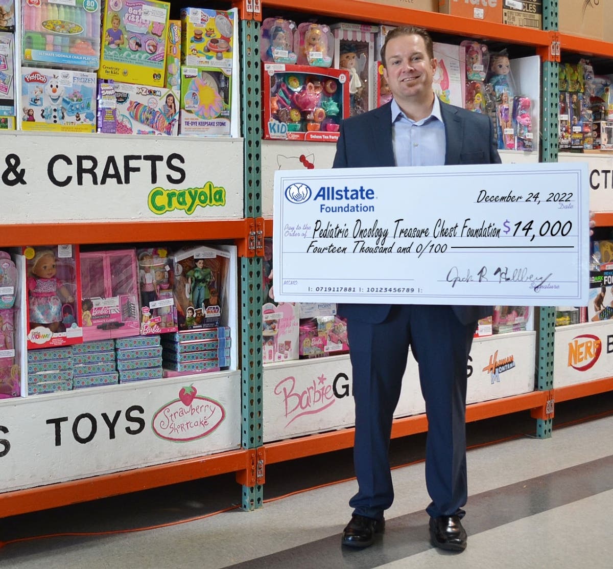 Allstate Agency Owner and grant organizer Jack R. Hallberg proudly presents the $14,000 donation while visiting at the Pediatric Oncology Treasure Chest Foundation’s Orland Park facility. This donation will help support thousands of children and teens.