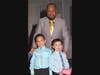 Honorary Chairperson Avery (age 4), brother Evan (age 5) are all smiles after being presented with their favorite toys during the Eleventh Annual Treasuring Our Kids event as dad Corey looks on.