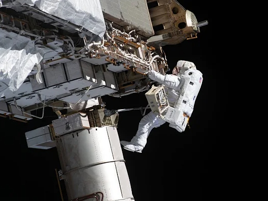 An astronaut makes repairs and upgrades to the International Space Station Monday, Feb. 1.