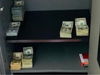 The LAPD arrested three people and confiscated guns and 662,809 counterfeit goods at a Downtown warehouse.
