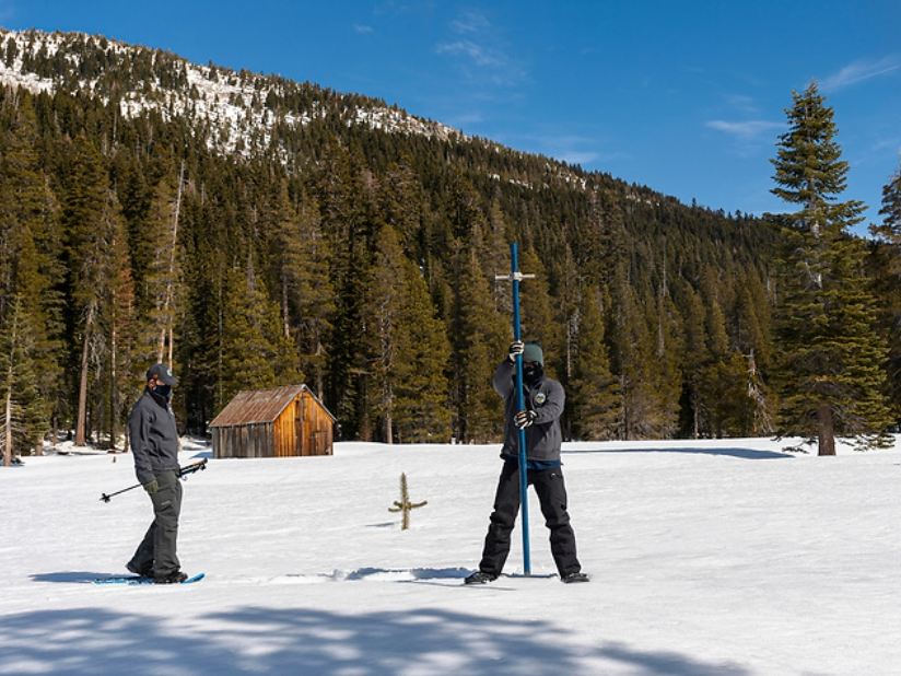 Water Resources Engineer Anthony Burdock (L) an Engineer in the Snow Surveys and Water Supply Forecasting Section  and Sean de Guzman, Chief of the Snow Survey and Water Supply Forecast Section (R) are seen at a March 2 snow survey event.