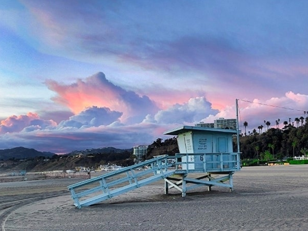 Incredible clouds move over the ocean and sand in Santa Monica
