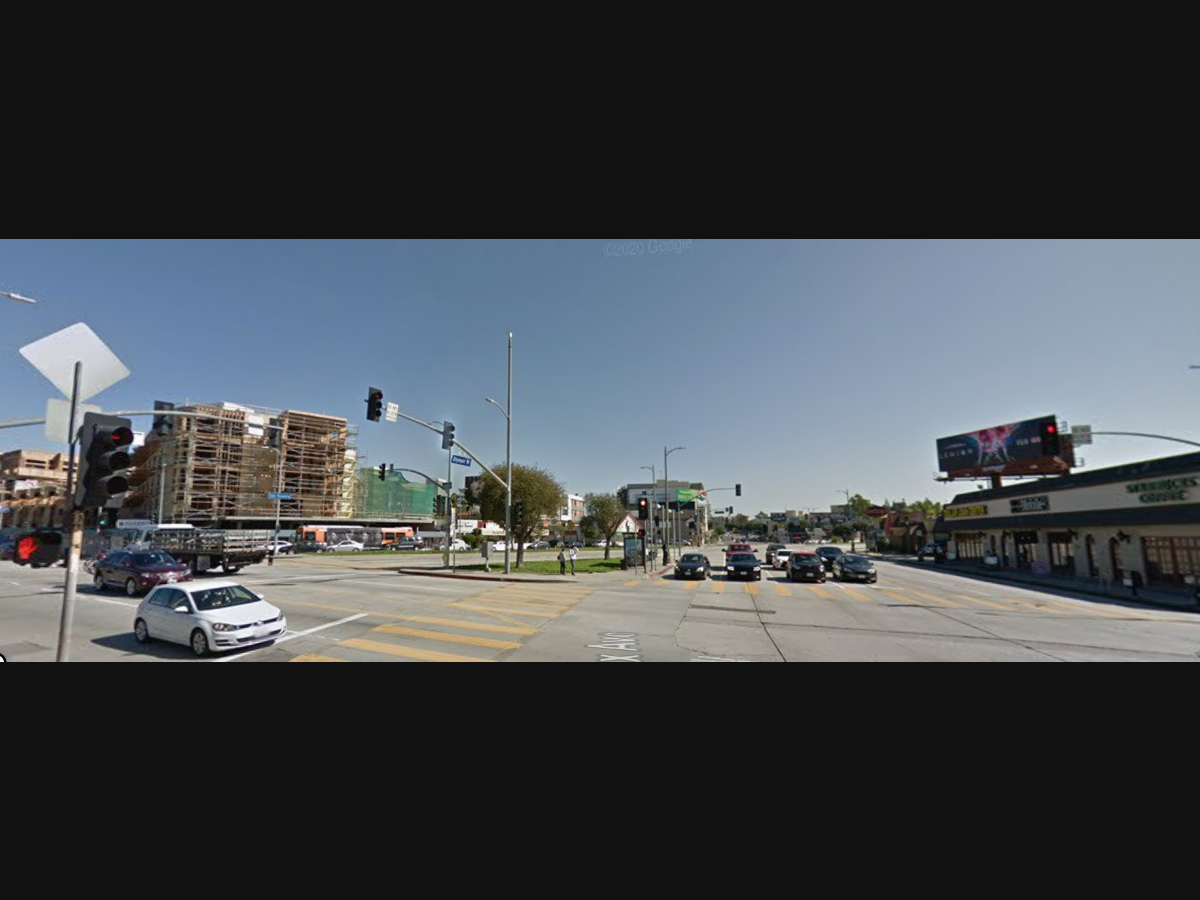 A woman is accused of brandishing a gun at the busy intersection of Fairfax Avenue and Olympic Boulevard while threatening other drivers.