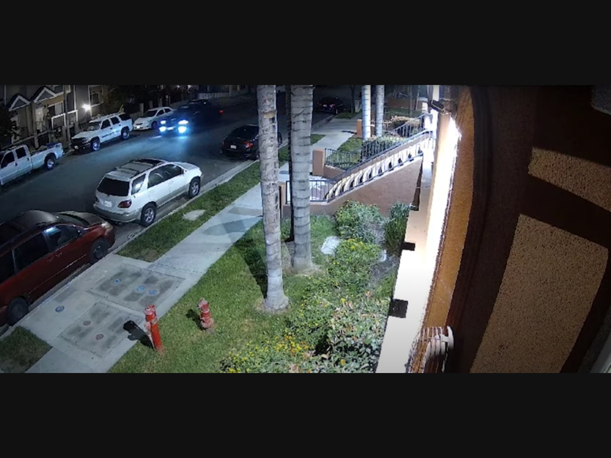 The hit-and-run suspect's vehicle passes a security camera in the area of the crash.