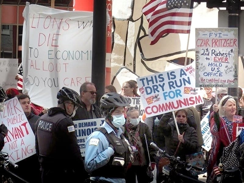 Protesters gather Friday outside​ the Thompson Center to demand that Gov. J.B. Pritzker lift his coronavirus restrictions and reopen the state's economy. 