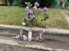 Flowers and candles placed near the site where a 16-year-old was slain Tuesday in Joliet.