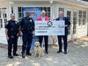 Check presentation with LUPD Chief Mike Zegadlo, Handler Lyle Nettles with Jet, State’s Attorney Glasgow and Lewis University President David Livingston