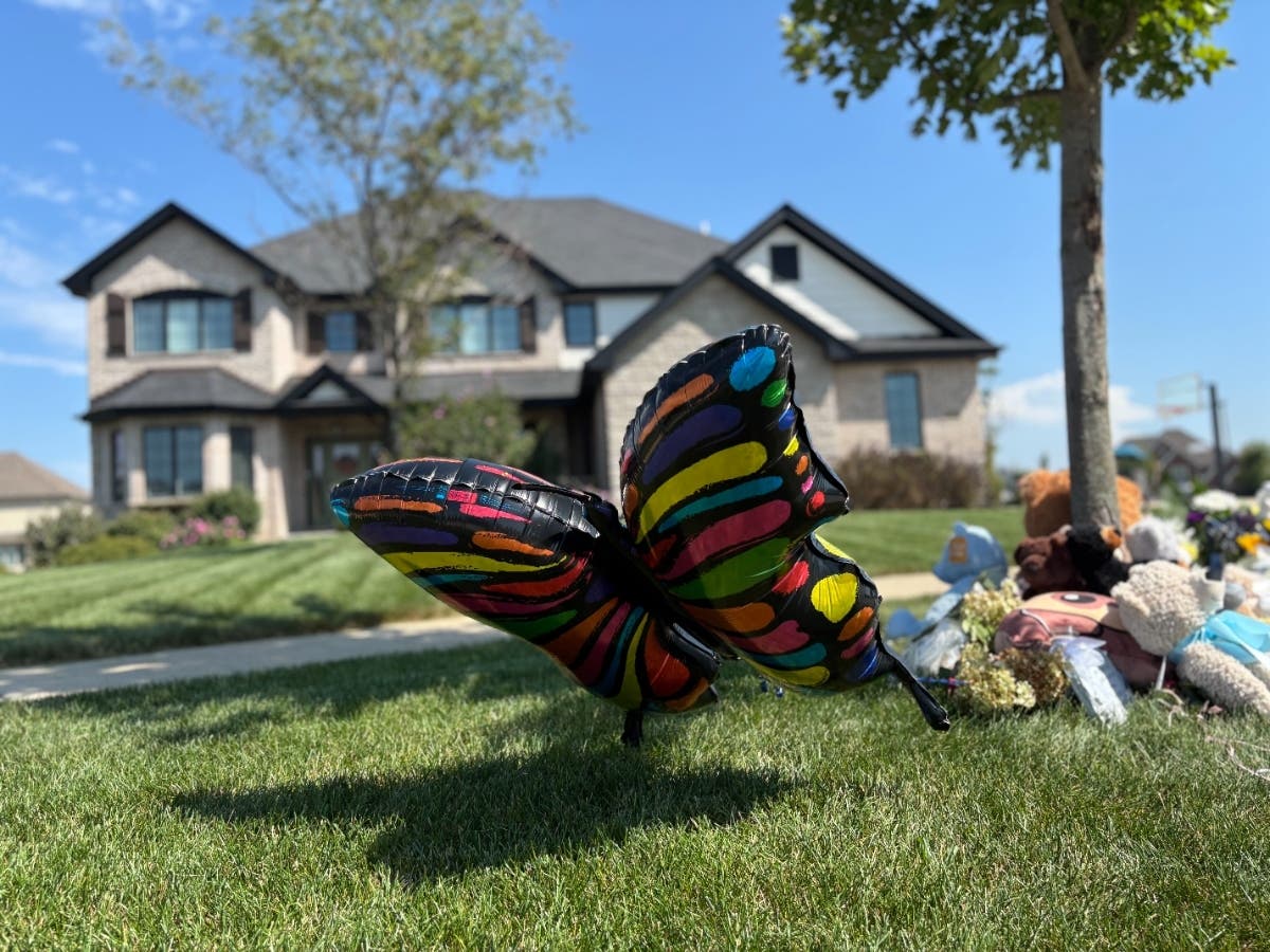 Balloons and stuffed bears could be seen at the Brook Stone Court home where prosecutors say Corie Walsh killed her 2-year-old son. 