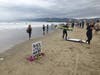Surfers held a paddle out Friday to honor George Floyd. 