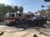 Firefighters responded to a crash in Santa Monica Wednesday next to a protest outside Santa Monica Police Department headquarters.
