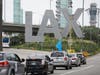 Rideshare drivers held a car caravan at LAX Thursday.