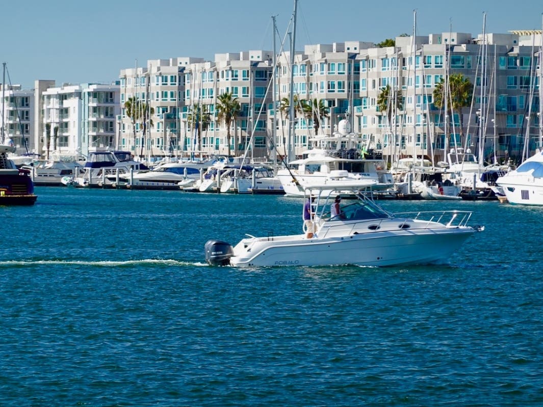 A boat passes by on a clear, summer day in Marina del Rey.