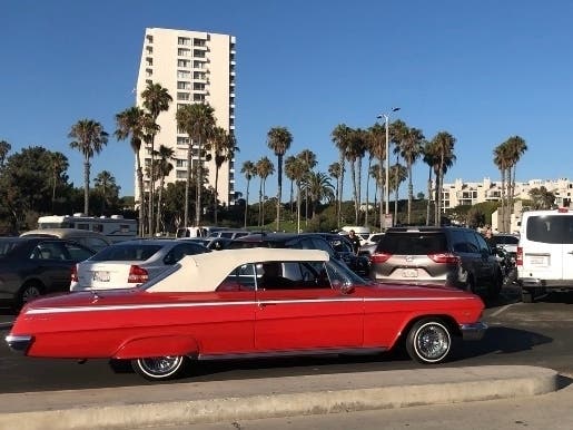 Lowriders pass by the boardwalk in Santa Monica and Venice.