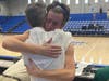 Jackson Strong hugs John Strong after college basketball game