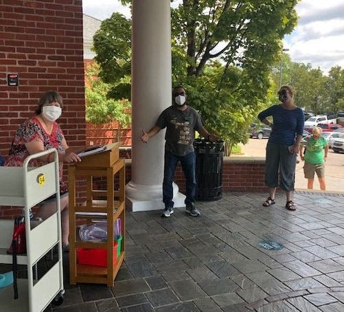 Plymouth Library Director, Carol Souchock (left) reopening our Plymouth Library...