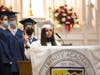 Owen Mulvihill (far left), Edward Ayuso (left), James LaMarca (center) and Katherine (Mackenzie) Mir present prayers of the faithful.