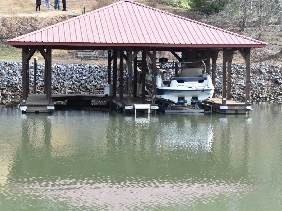 A 6-year-old boy fell from a pier and into cold water of Lake Hickory in Alexander County, North Carolina. A carpenter working across the cove heard his cry for help and swam to him, arriving just as others were pulling the boy from the lake.