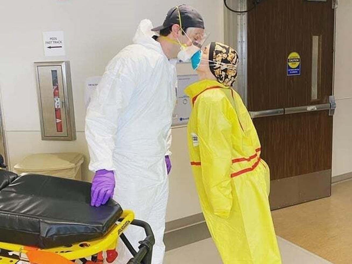 Andrea Dello Russo and Robert Tretola, front-line workers in the fight against the new coronavirus, still hope they can get married in a few weeks, but settled for a kiss.