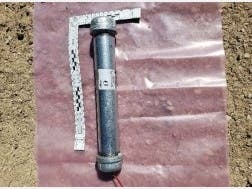 Federal authorities arrested a Loveland, Colorado, man after finding pipe bombs in a raid at his home, prompting a warning from the Department of Homeland Security that a white supremacist group might avenge his arrest, the Justice Department said.