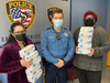 Kiwanis Club of Greater Roxbury Secretary Aysha Avalos, Roxbury Police Officer John J. Fitzgerald V and Kiwanis Club of Roxbury Treasurer Damian Hernandez