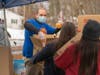 Kiwanis Club of Greater Roxbury President Cain packing boxes with food at a recent free food distribution.