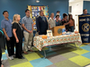 The passing of the Governor-Elect Banner: Current Governor-Elect Martin Slezak passed the banner to the newly elected Governor-Elect Frank Cahill, as members of the Kiwanis Club of Greater Parsippany joined in the celebration. 