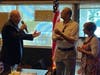 President Rich Moore congratulates new Rotary member Debanshu Bhattaacharya. Looking on is Mary Onorad (Past President of the Woodridge Rotary Club).