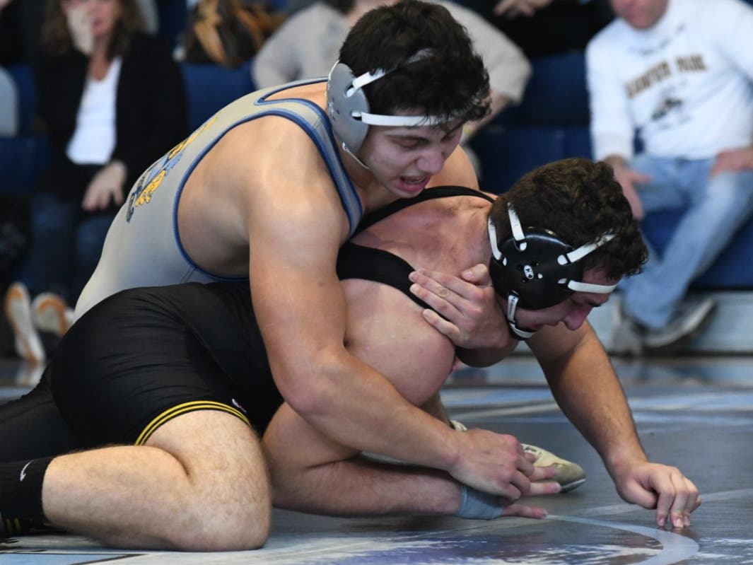 Jorge Montenegro's upset victory helped power the Wolfpack over county rival Hanover Park 49-21 Saturday.