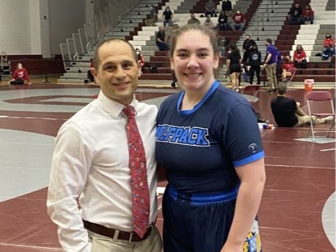 WMC junior Marisa DiPaolo displaying her bronze medal alongside Coach Ken Rossi.