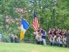 Color Guard of Massachusetts and Connecticut Sons of the American Revolution lower the standard during Taps