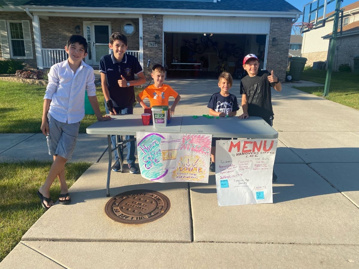 A group of neighborhood kids, behind the counter at their own "Hanover Kids' Café" at Hanover Drive and Milford Avenue in Tinley Park.