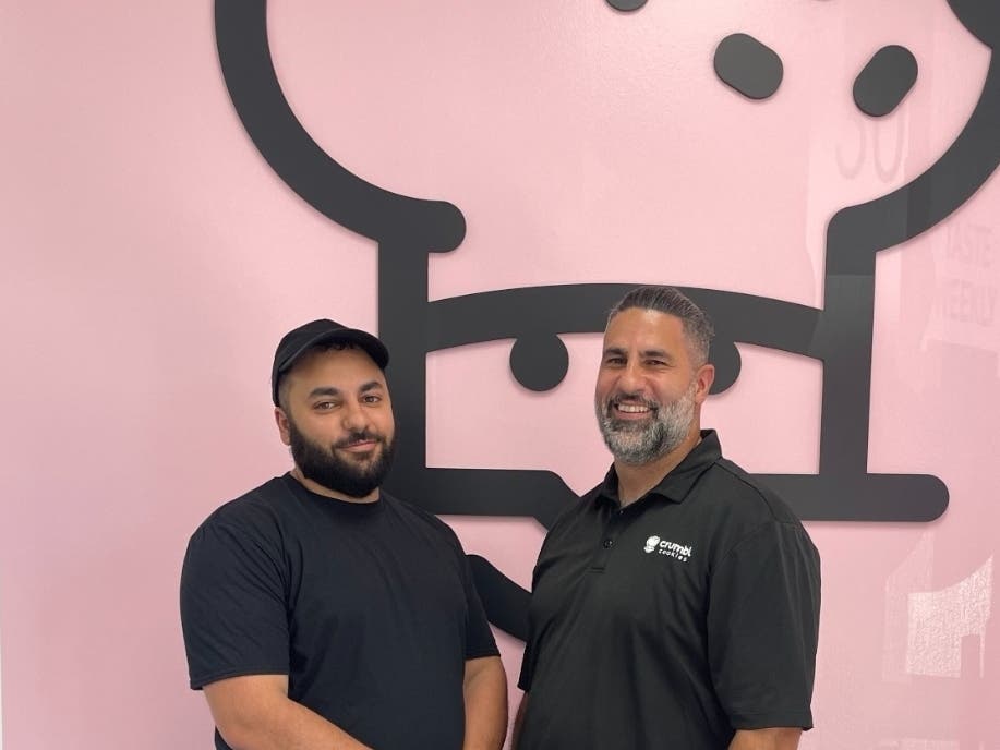 Lifelong friends Ahmed Mahmoud and Omar Bayazid will open their own Crumbl Cookies in Orland Park on Friday. 