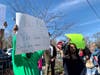 Protesters gather outside Homewood-Flossmoor High School Thursday, Nov. 3. 