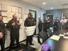Homewood police donate a check for more than $1,000 to Anew Domestic Violence Shelter. 