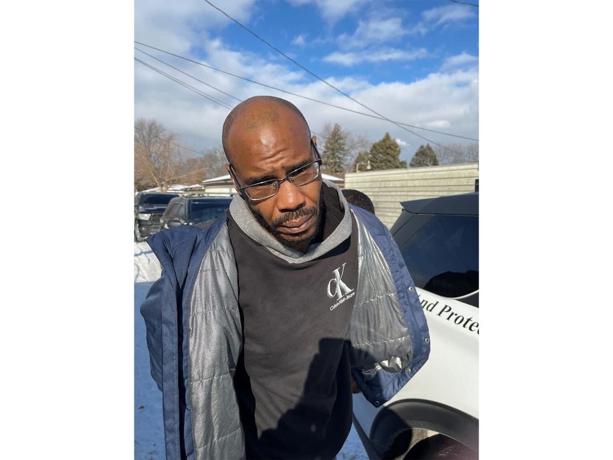 Julius Burke Jr., 47, as he was apprehended in connection with the slaying of beloved Momence bar owner Courtney Drysdale. 