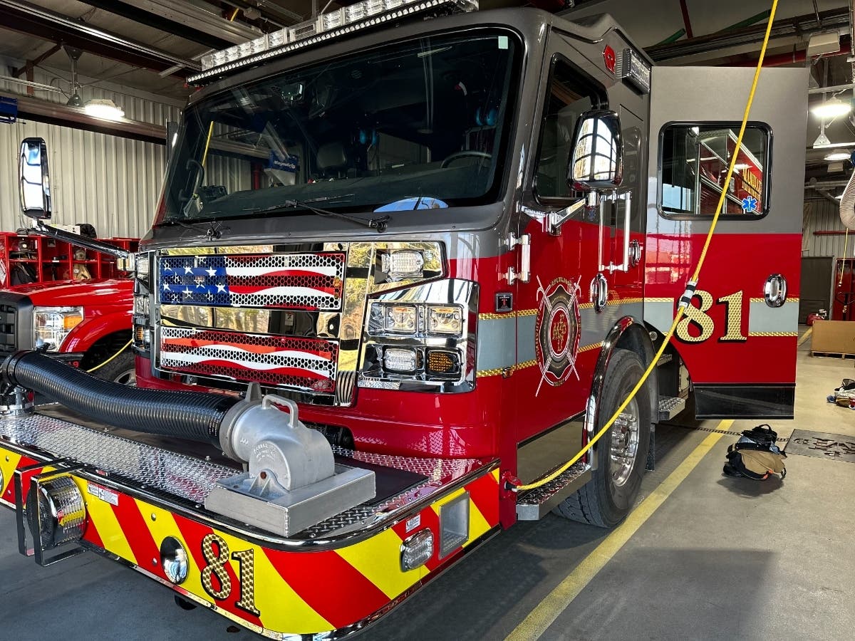 A woman and two dogs are safe after an attic fire in unincorporated Manhattan Monday afternoon, fire officials said. 
