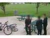 Still frames from video footage show some children at Main Park, where picnic tables were damaged. 