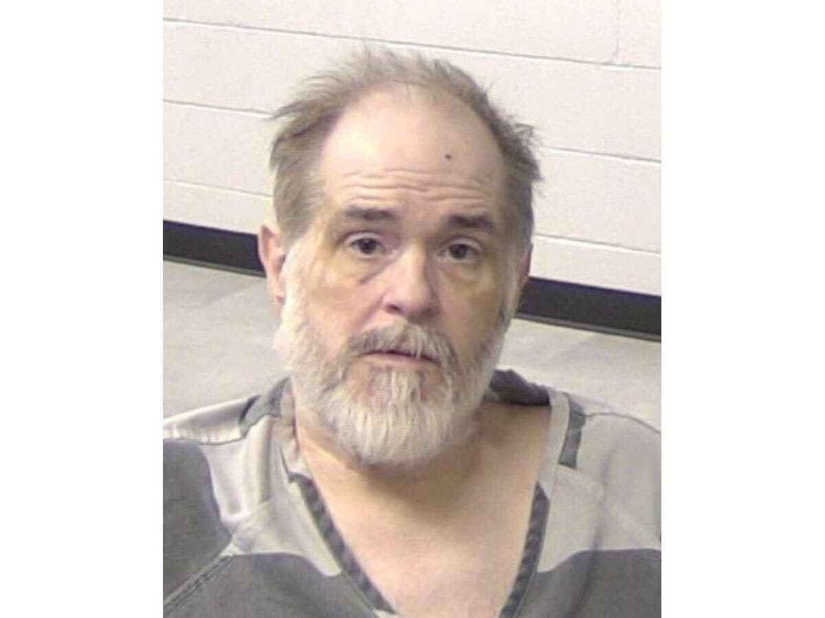 A 54-year-old Decatur man was arrested and charged after police said he pointed a crossbow at police before being shot, Illinois State Police said Wednesday. 