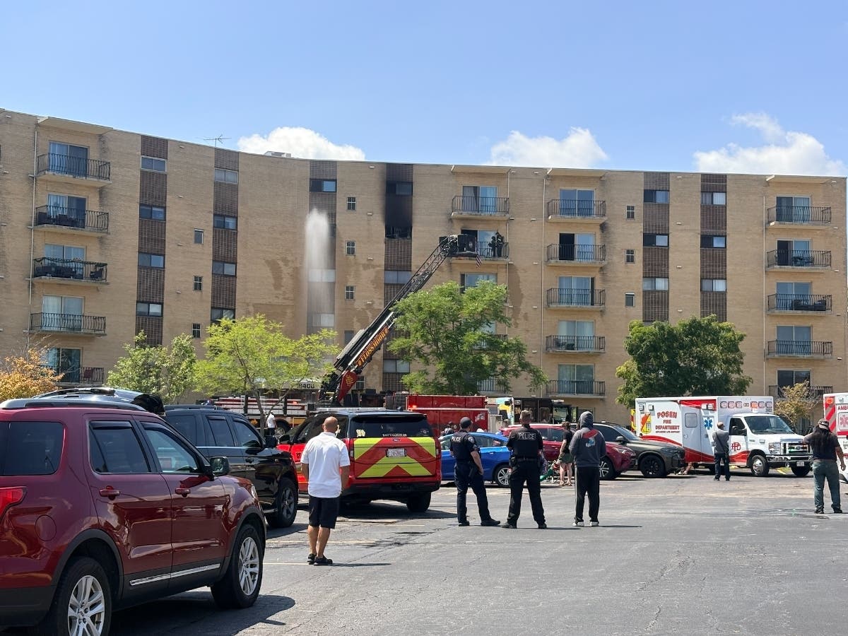 A fire in a six-story apartment building in Homewood was contained Tuesday afternoon, officials said. 
