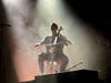 Quenton Blache, cellist for Andy Grammer, opens Grammer's first song in New Lenox Saturday, Aug. 15. 