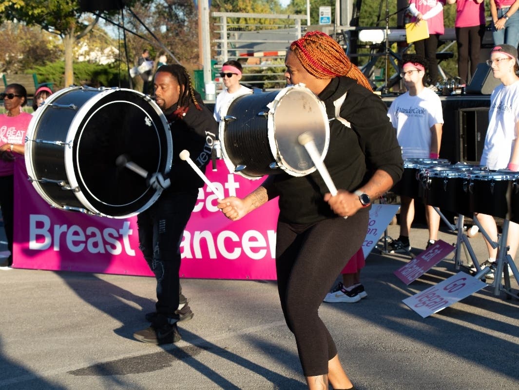 A drumline performs at a Let's Beat Breast Cancer rally in 2024.