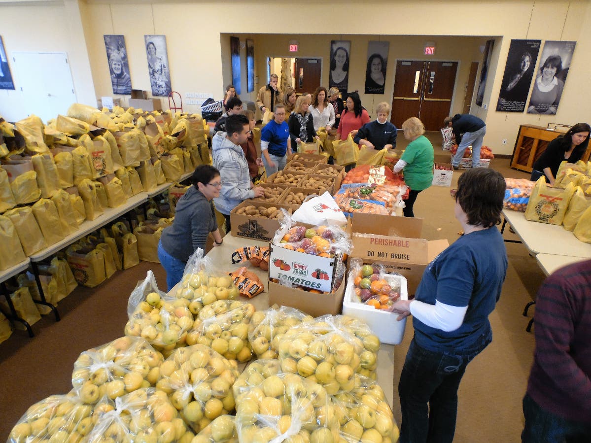 Volunteers bag food at Project Self-Sufficiency for distribution to needy families at Thanksgiving.