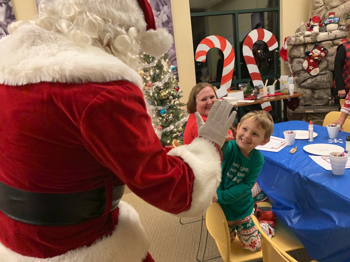Sussex County Freeholder George Graham dressed up as Santa to entertain low-income children at Project Self-Sufficiency.