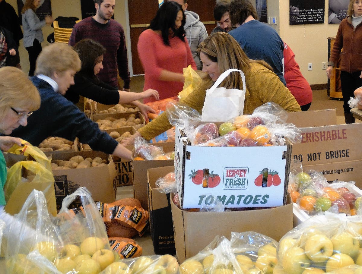 Volunteers will pack Thanksgiving dinners for hundreds of local families at Project Self-Sufficiency.