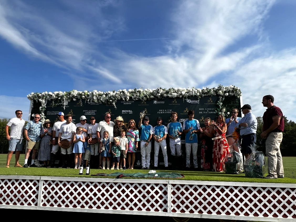 First Hope Bank and Lakeside Construction celebrated their tying score at the Project Self-Sufficiency Fall Polo Classic held at Grayfields Polo Club in Allamuchy.