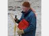 Jim Gallagher studying beach topography