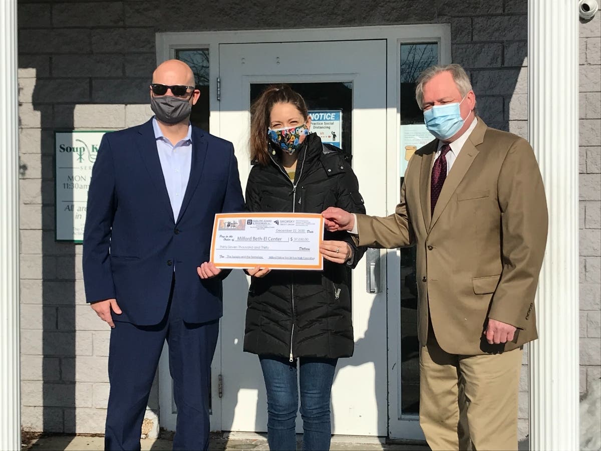 Kenneth Ferrari, Senior VP at Sikorsky Financial Credit Union and Attorney Joseph Kubic from Harlow, Adams & Friedman, P.C. presented Jenn Paradis of the Beth-El Center with proceeds from the Milford Trick or Trot 5K..